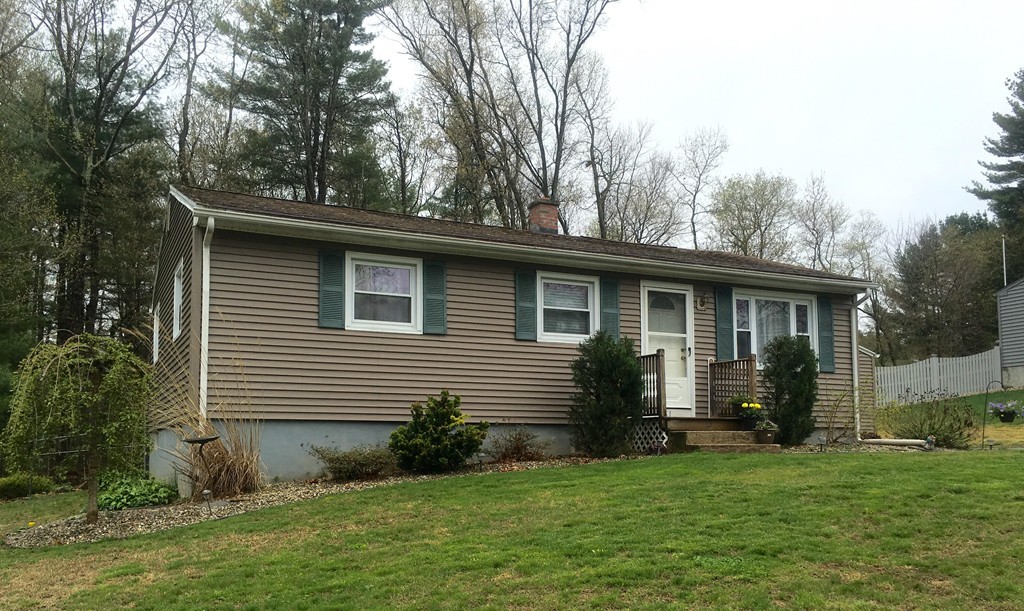 61 Tioga Street Springfield, MA 01128 - Photo 3 of 20 a front view of a house with a garden