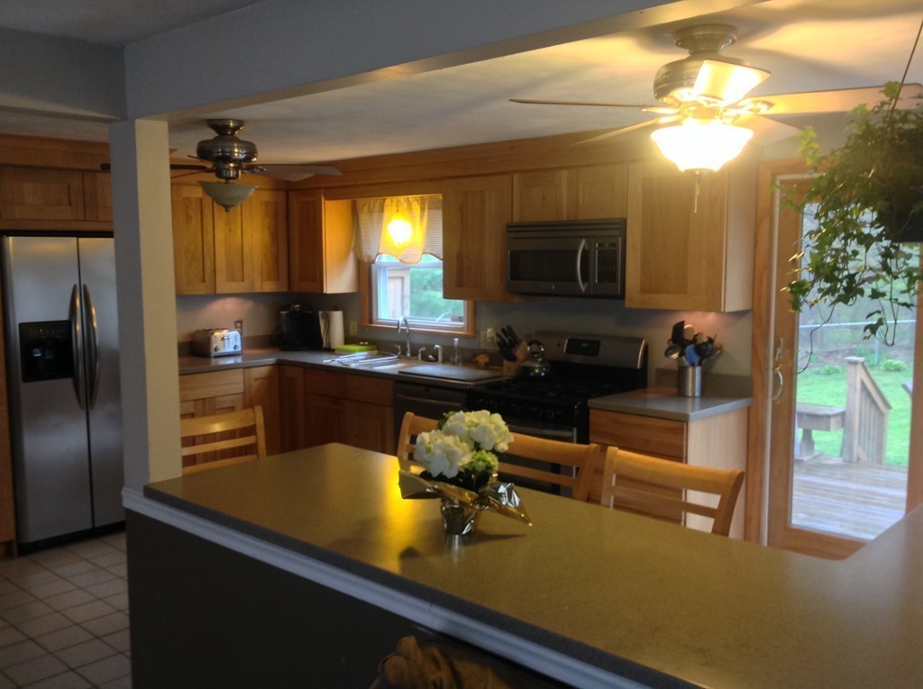 61 Tioga Street Springfield, MA 01128 - Photo 4 of 20 a kitchen with a sink appliances and cabinets