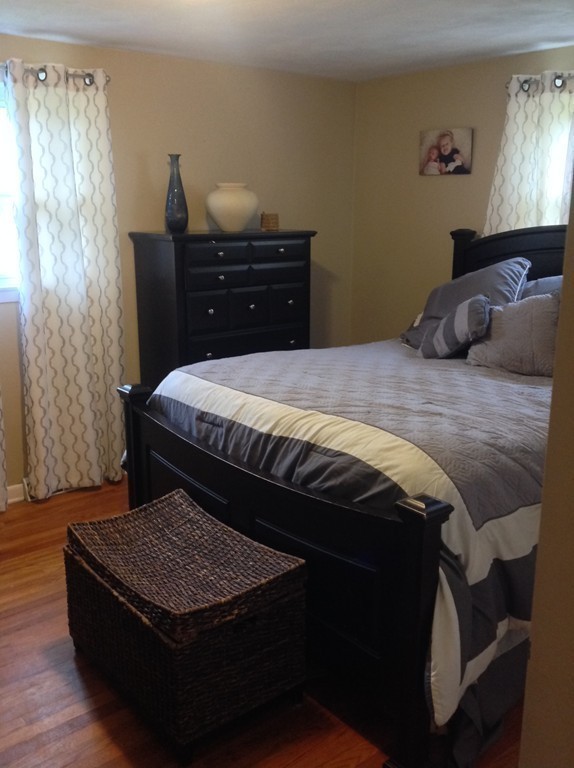 61 Tioga Street Springfield, MA 01128 - Photo 9 of 20 a bedroom with a bed and dresser