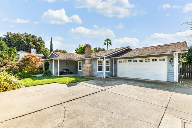 a view of house with outdoor space and street view