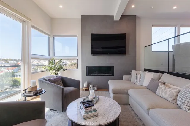 a living room with furniture fireplace and a flat screen tv