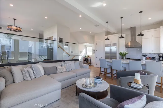 a living room with furniture kitchen and a view