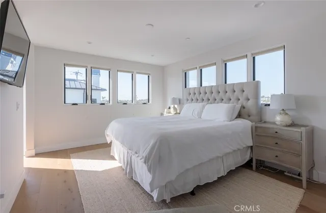 a bedroom with a bed and a night stand