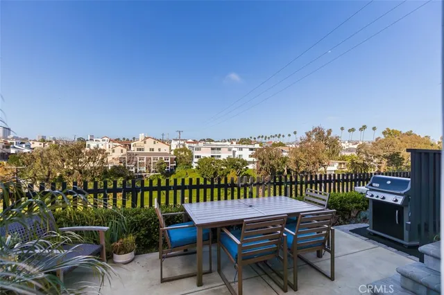 a view of a chairs and table in patio