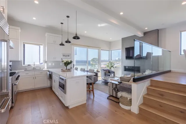 a kitchen with sink cabinets and wooden floor
