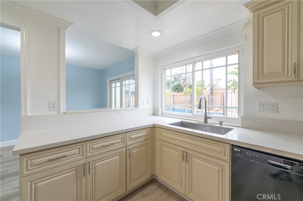 31 Carson Irvine, CA 92620 - Photo 15 of 50 a kitchen with white cabinets and a window