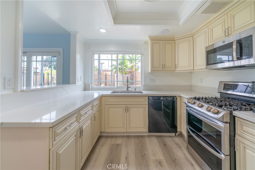 31 Carson Irvine, CA 92620 - Photo 17 of 50 a kitchen with stainless steel appliances granite countertop a stove and a sink