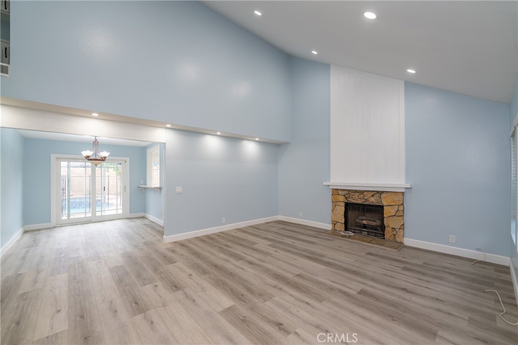 31 Carson Irvine, CA 92620 - Photo 2 of 50 a view of an empty room with wooden floor and a fireplace