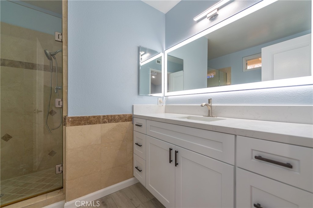 31 Carson Irvine, CA 92620 - Photo 28 of 50 a bathroom with a sink and a mirror