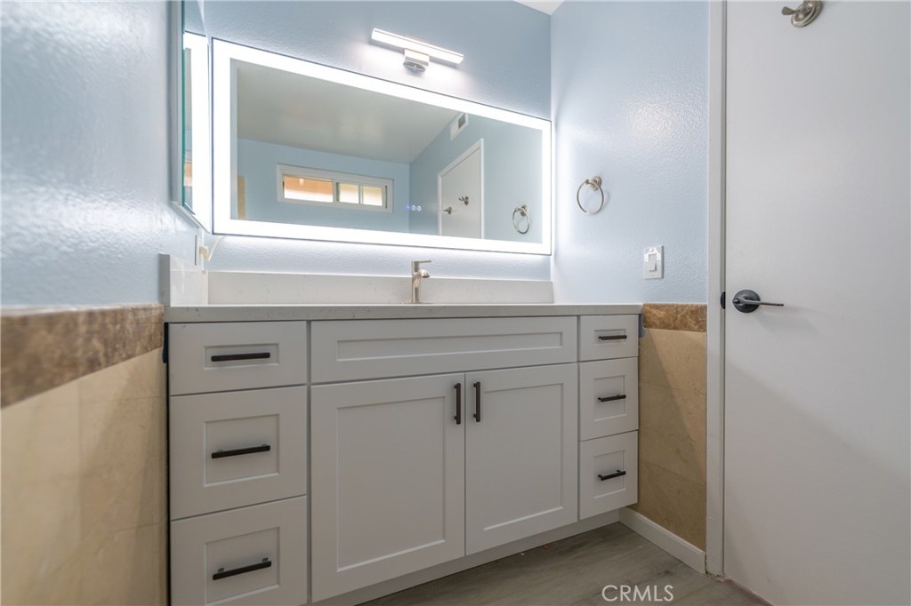 31 Carson Irvine, CA 92620 - Photo 29 of 50 a bathroom with a shower sink and mirror
