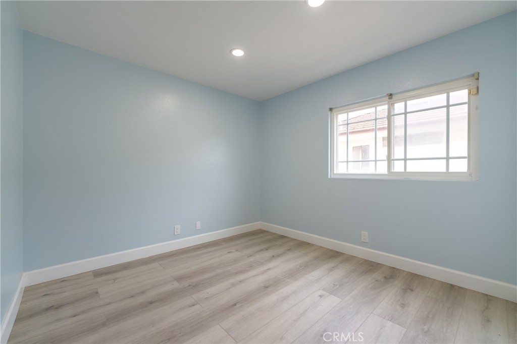 31 Carson Irvine, CA 92620 - Photo 30 of 50 an empty room with wooden floor and windows