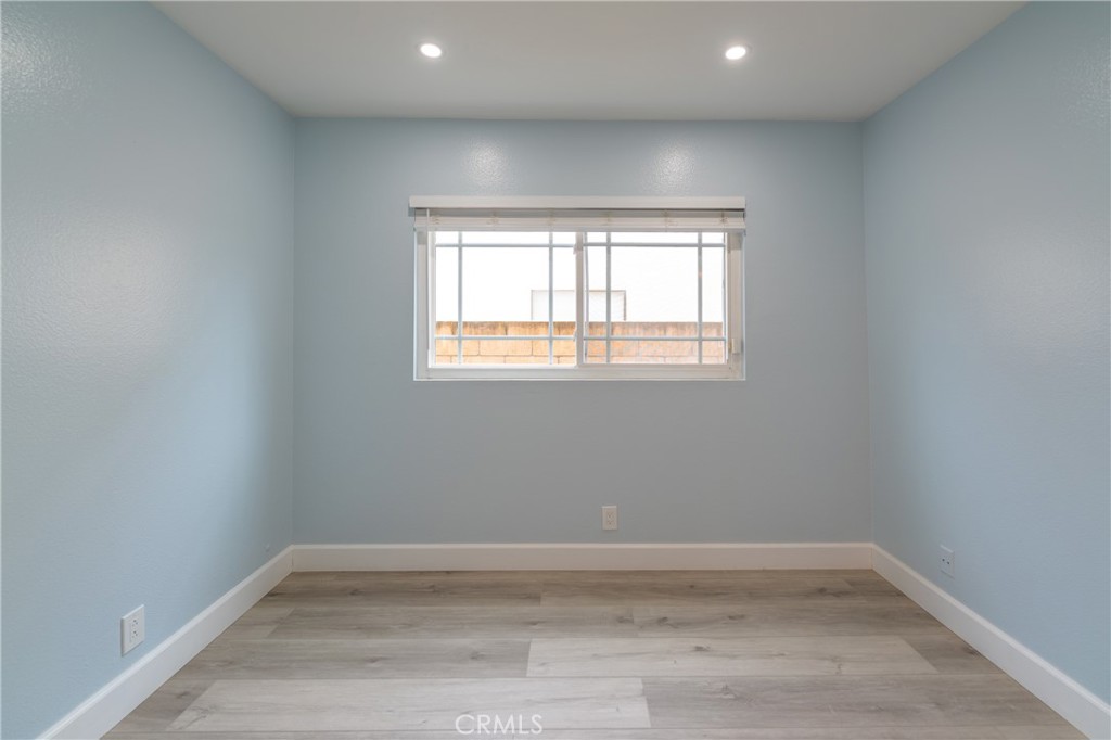 31 Carson Irvine, CA 92620 - Photo 31 of 50 an empty room with wooden floor and windows