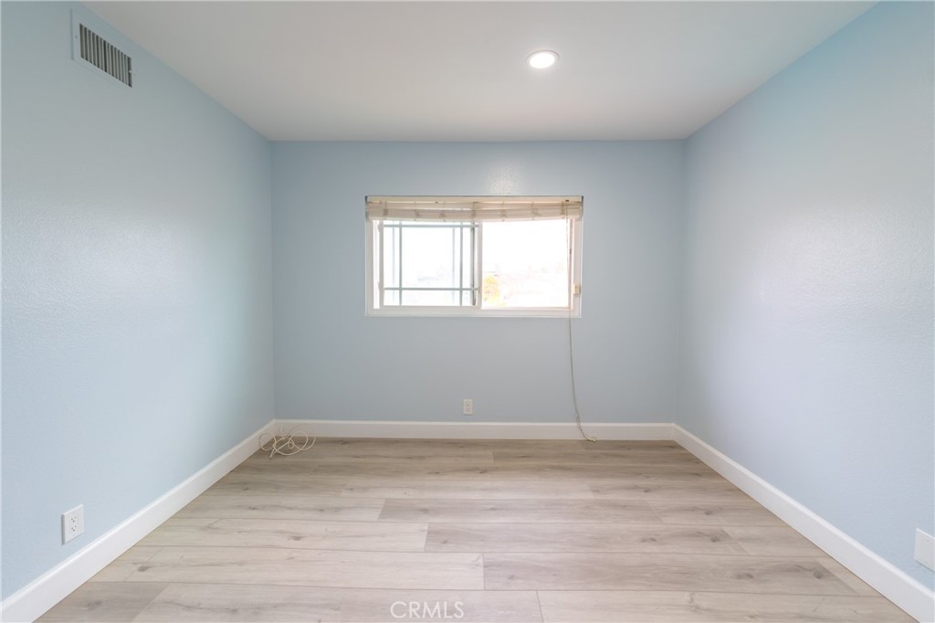 31 Carson Irvine, CA 92620 - Photo 37 of 50 an empty room with wooden floor and window