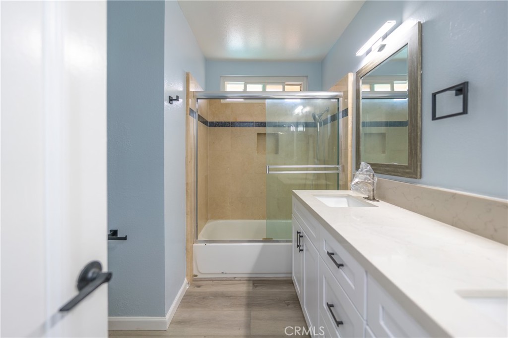 31 Carson Irvine, CA 92620 - Photo 38 of 50 a bathroom with a double vanity sink and mirror with shower