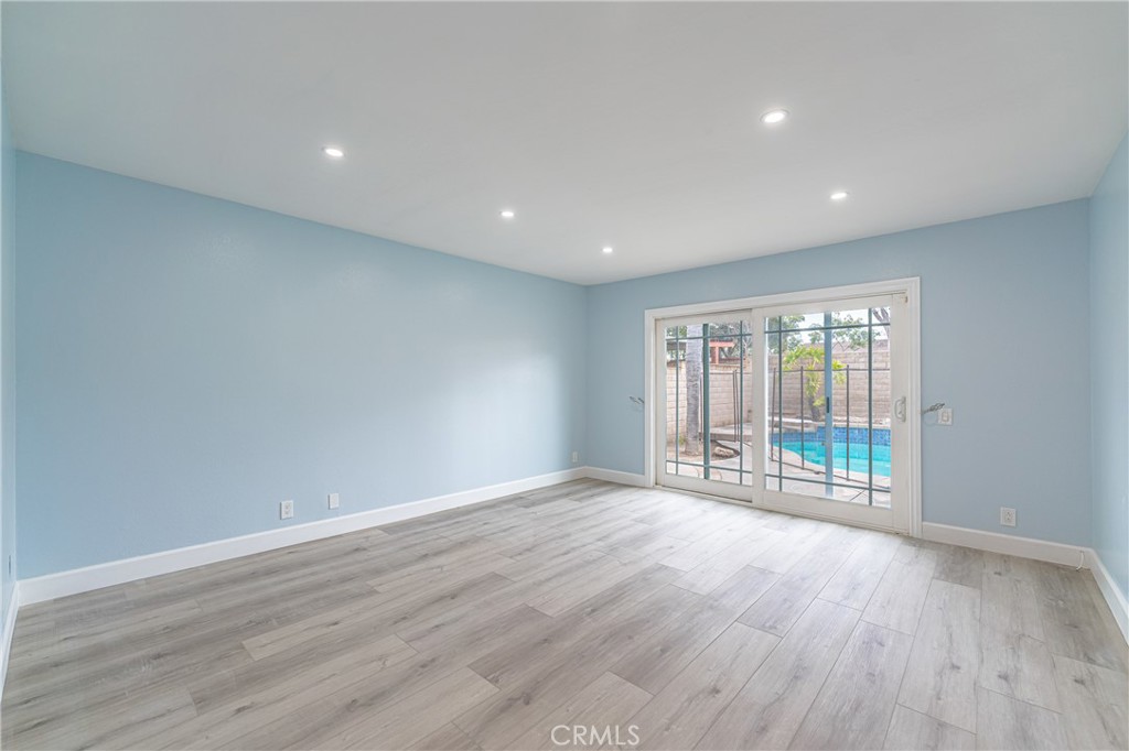 31 Carson Irvine, CA 92620 - Photo 7 of 50 a view of an empty room with wooden floor and a window