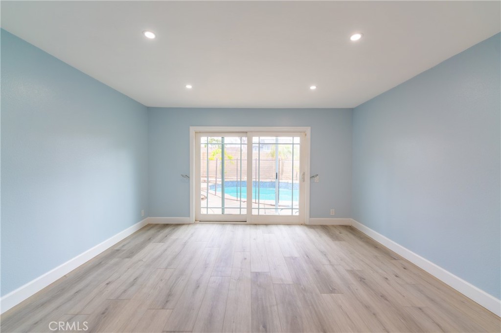 31 Carson Irvine, CA 92620 - Photo 8 of 50 a view of an empty room with wooden floor and a window