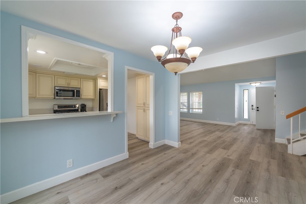 31 Carson Irvine, CA 92620 - Photo 10 of 50 a view of a kitchen with a sink wooden floor and staircase