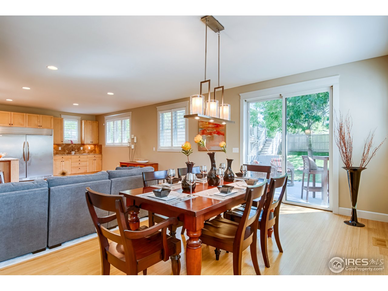 1412 North Street Boulder, CO 80304 - Photo 14 of 39 a dining room with furniture a chandelier and wooden floor