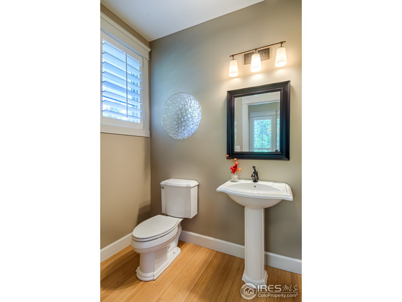 1412 North Street Boulder, CO 80304 - Photo 16 of 39 a bathroom with a toilet a sink and mirror