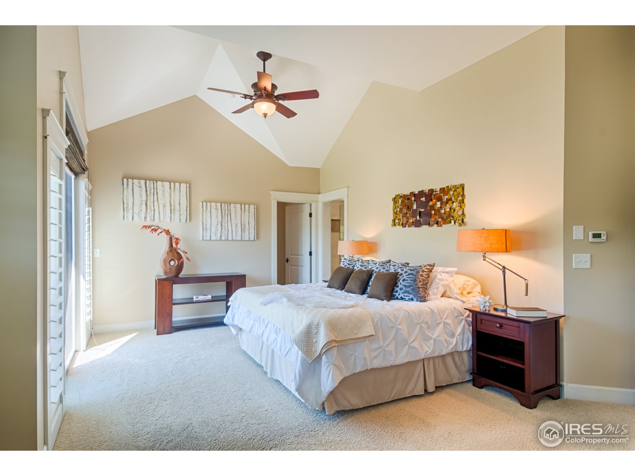 1412 North Street Boulder, CO 80304 - Photo 18 of 39 a bedroom with a bed and wooden floor