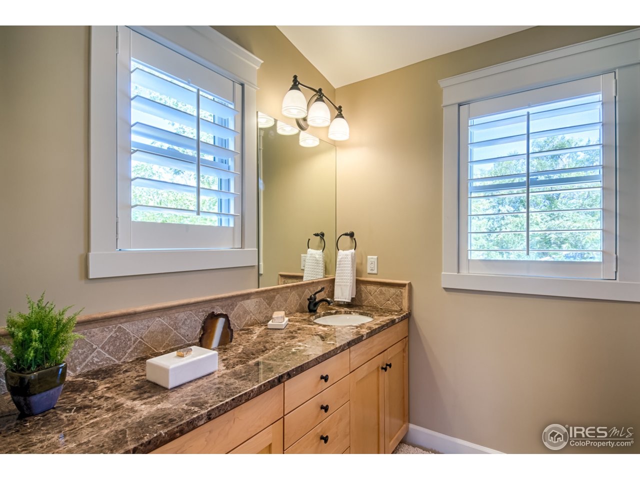 1412 North Street Boulder, CO 80304 - Photo 20 of 39 a bathroom with a granite countertop sink and a mirror
