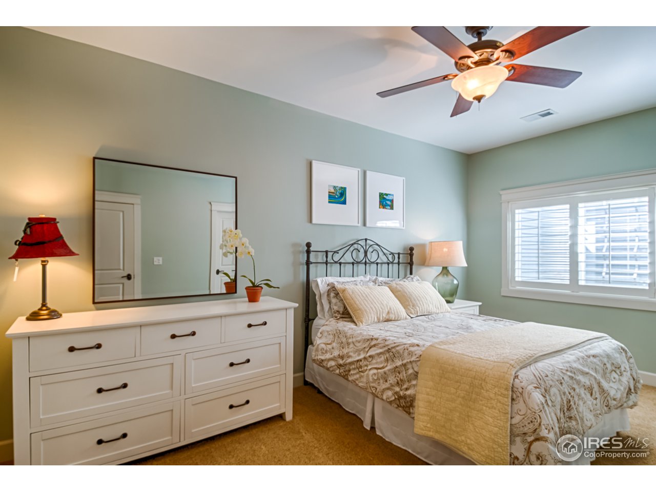 1412 North Street Boulder, CO 80304 - Photo 32 of 39 a bedroom with a large bed and a chandelier