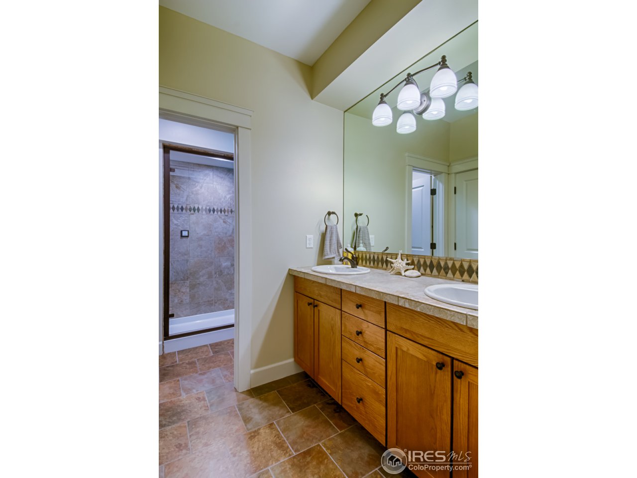 1412 North Street Boulder, CO 80304 - Photo 34 of 39 a bathroom with a sink and a mirror