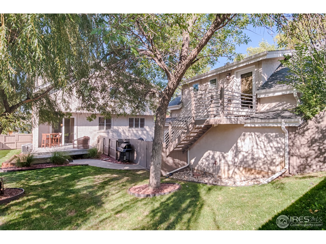 1412 North Street Boulder, CO 80304 - Photo 36 of 39 a backyard of a house with yard and outdoor seating