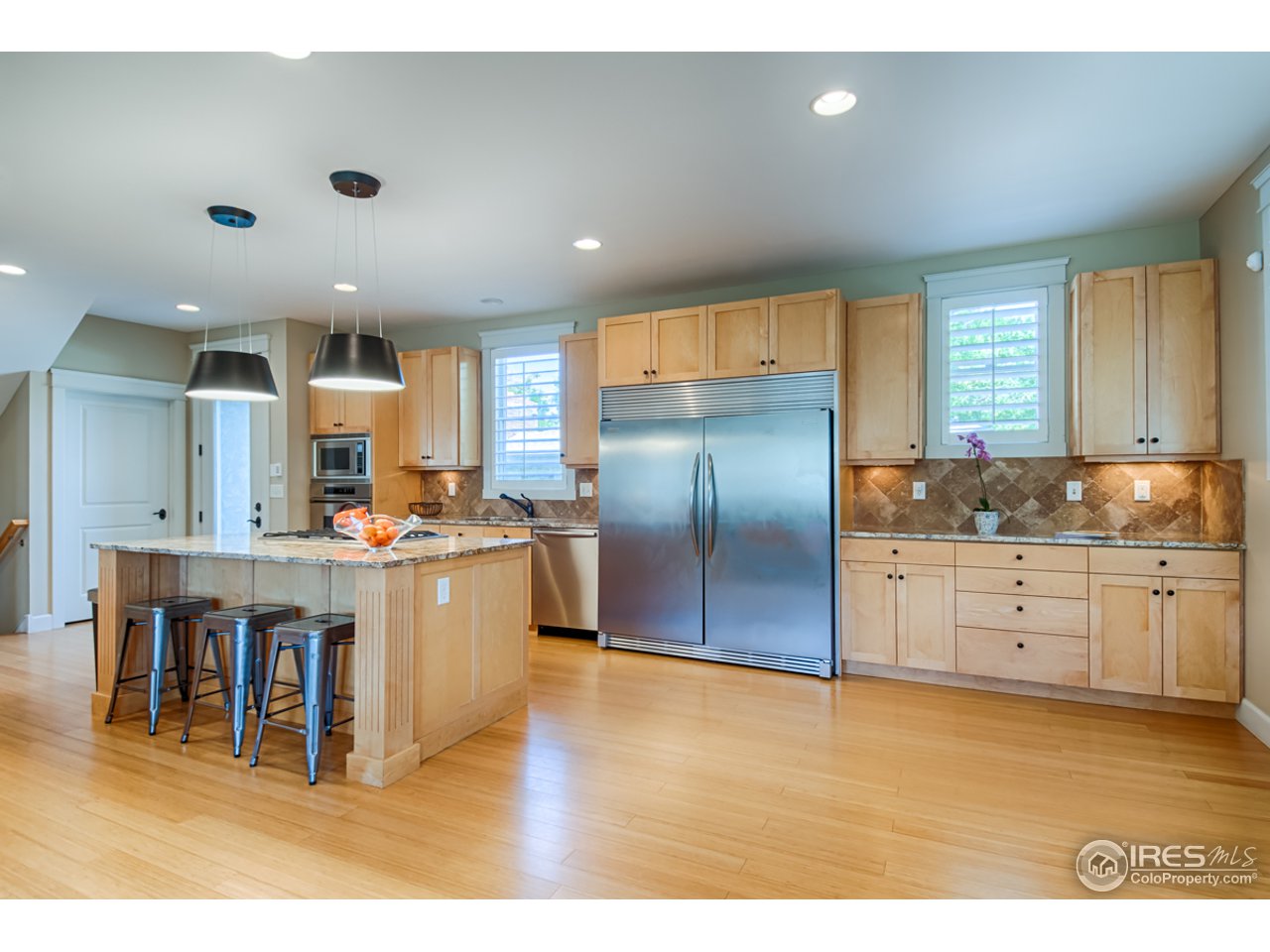 1412 North Street Boulder, CO 80304 - Photo 7 of 39 a kitchen with stainless steel appliances a refrigerator sink and cabinets