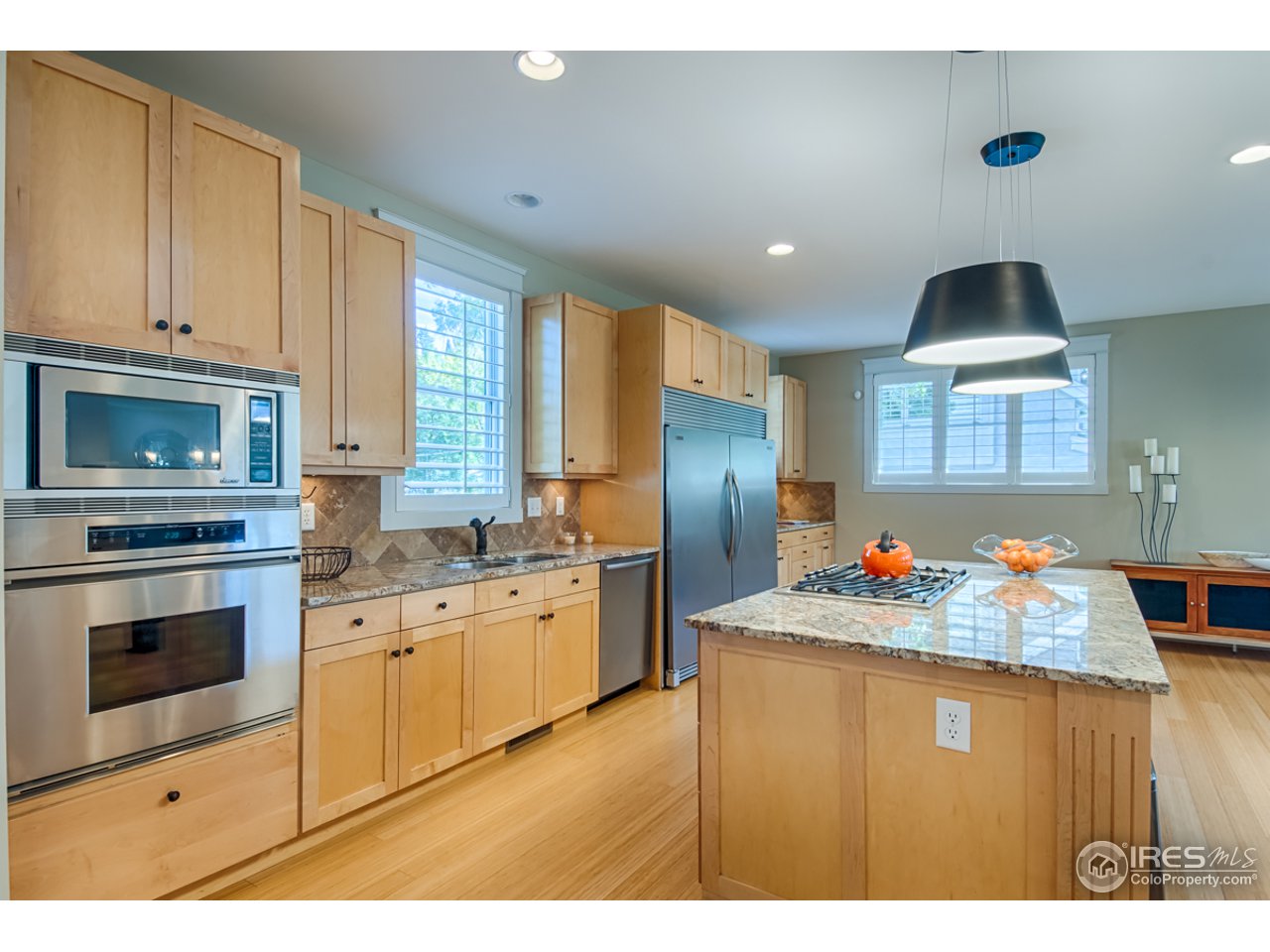1412 North Street Boulder, CO 80304 - Photo 9 of 39 a kitchen with granite countertop a sink stainless steel appliances and cabinets