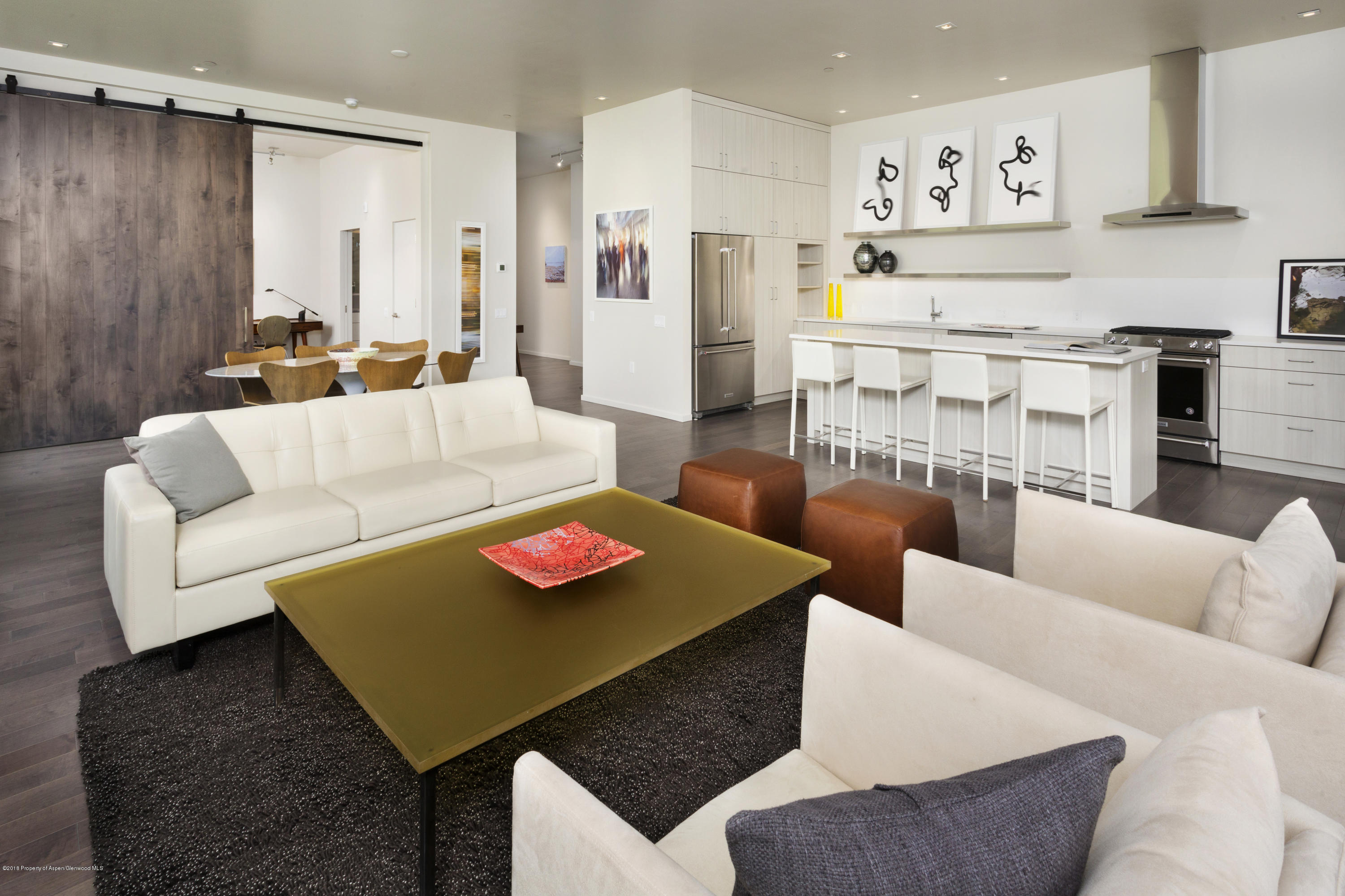 a living room with furniture and a table