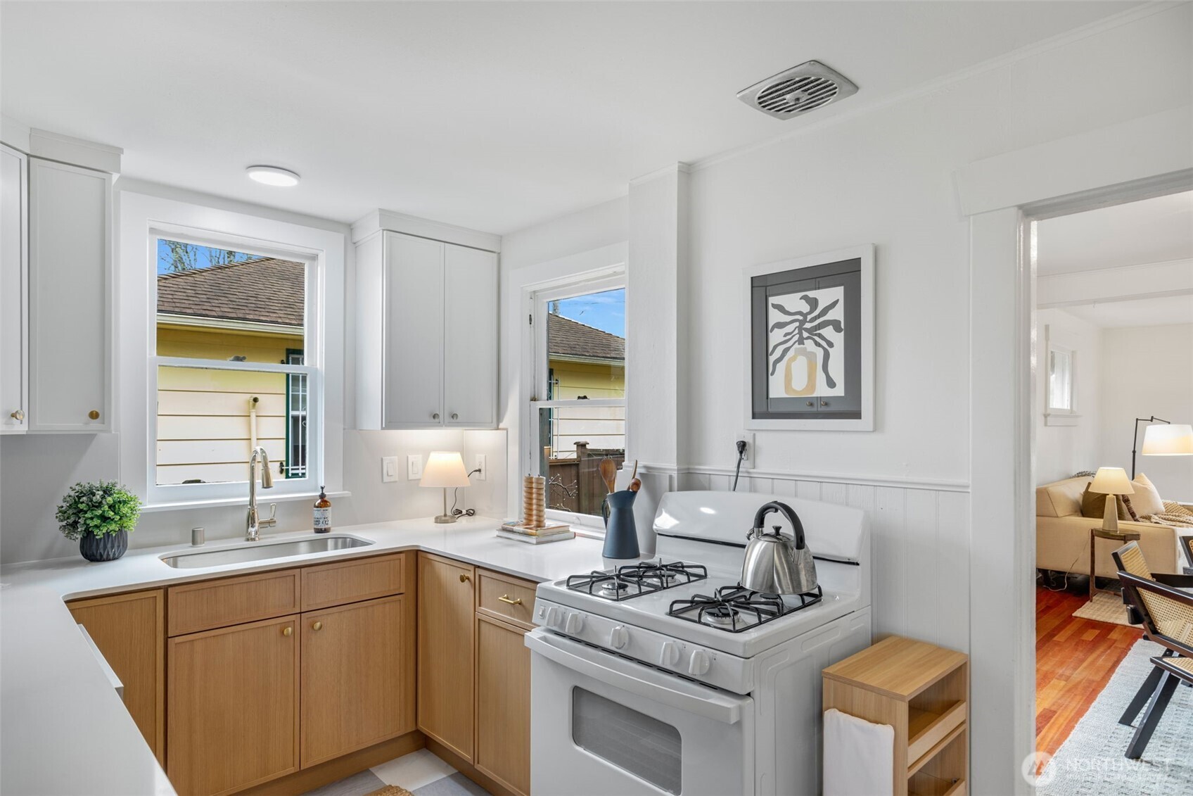 5812 46th Avenue South Seattle, WA 98118 - Photo 14 of 40 a kitchen with stainless steel appliances granite countertop a stove and a sink