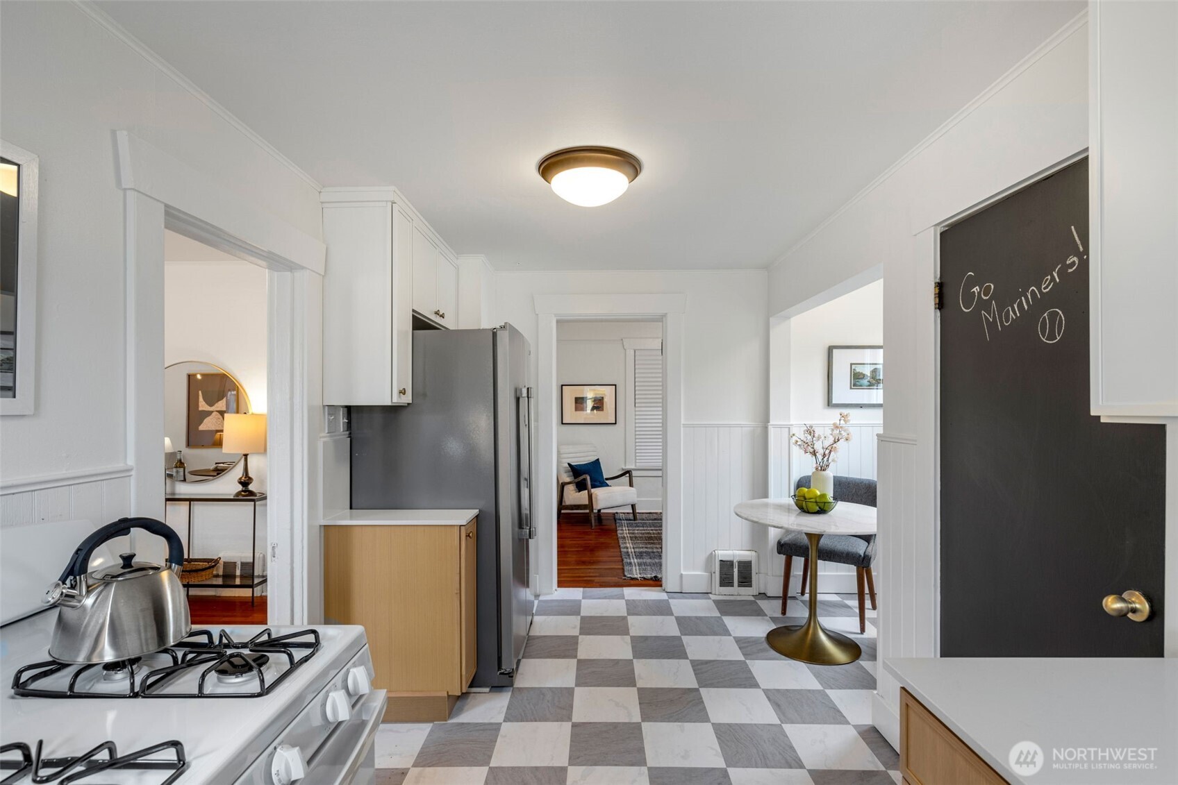 5812 46th Avenue South Seattle, WA 98118 - Photo 15 of 40 a kitchen with a refrigerator and a stove top oven