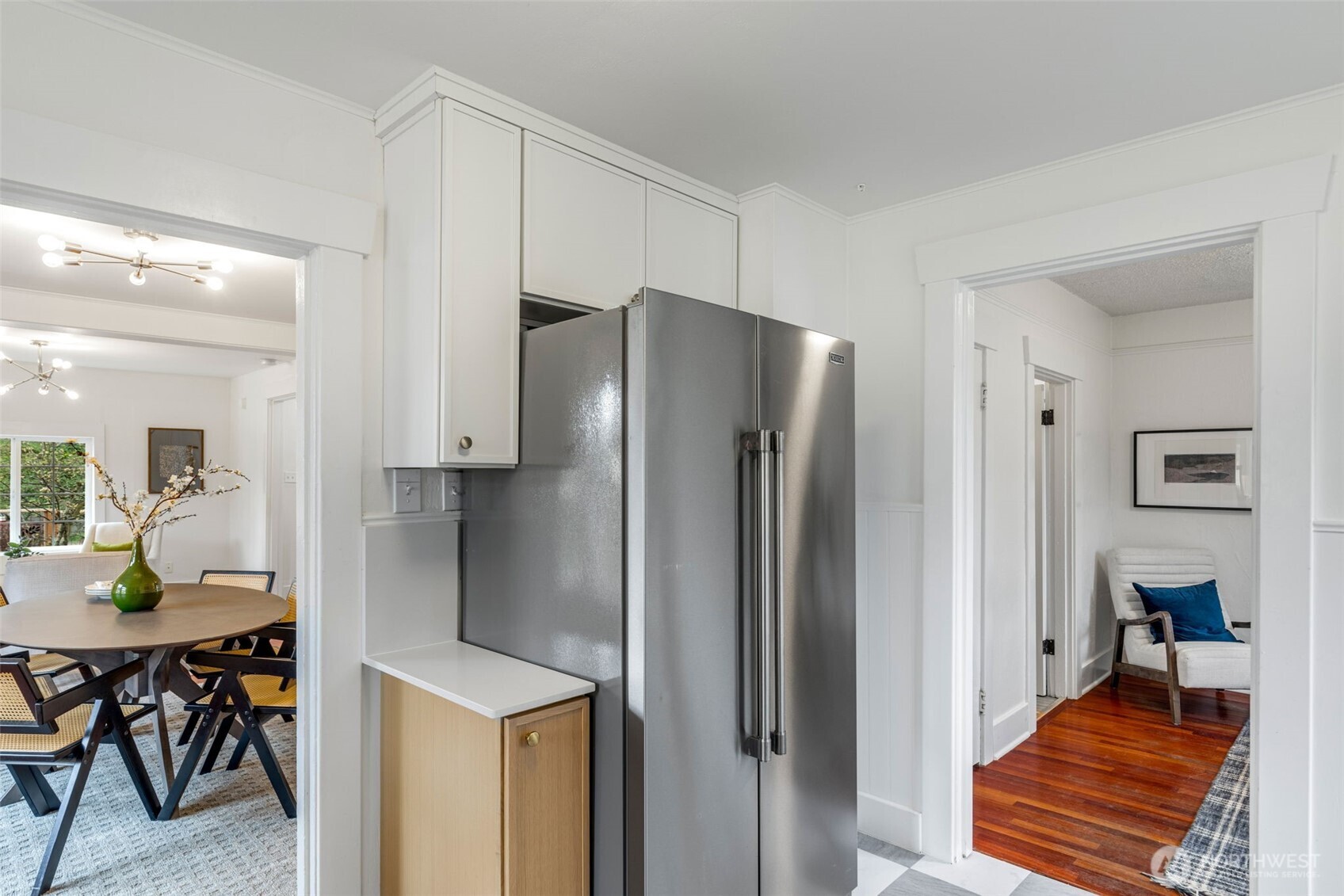 5812 46th Avenue South Seattle, WA 98118 - Photo 16 of 40 a kitchen with stainless steel appliances refrigerator and dining table