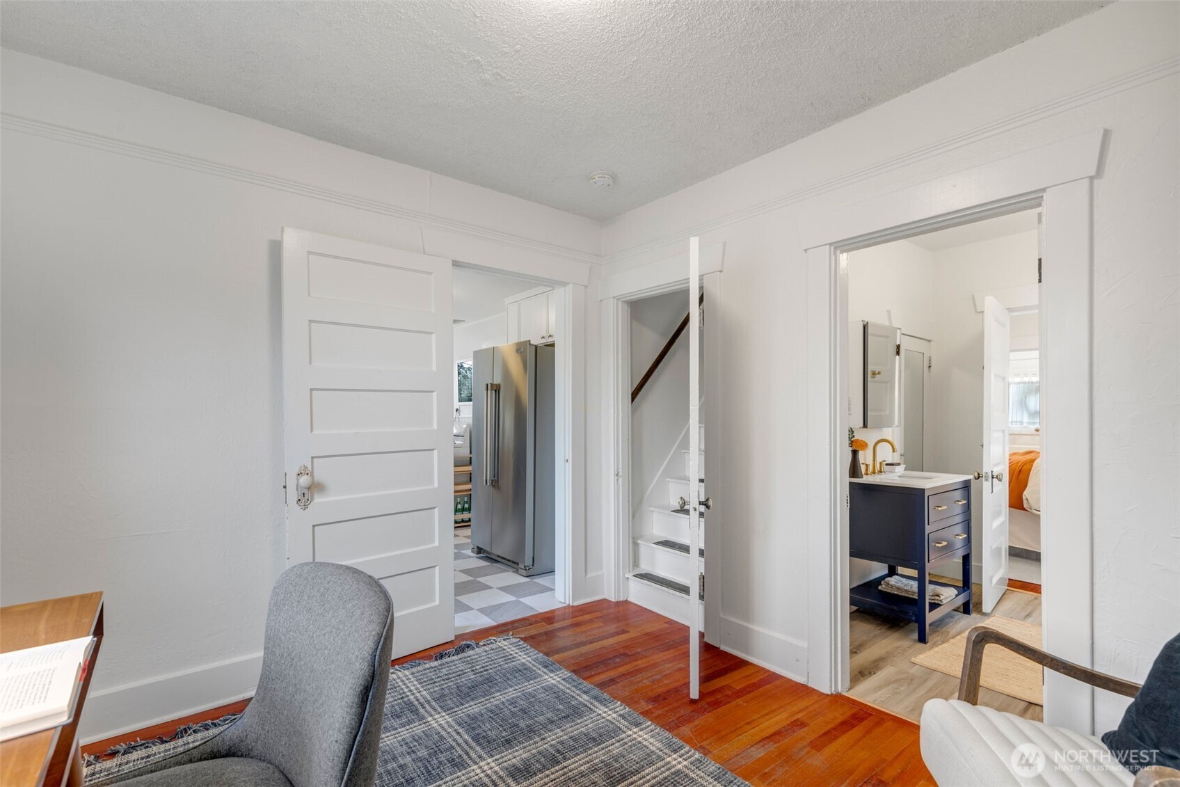 5812 46th Avenue South Seattle, WA 98118 - Photo 19 of 40 a bedroom with furniture and a wooden floor