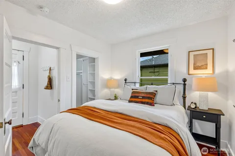 a bedroom with a bed and window