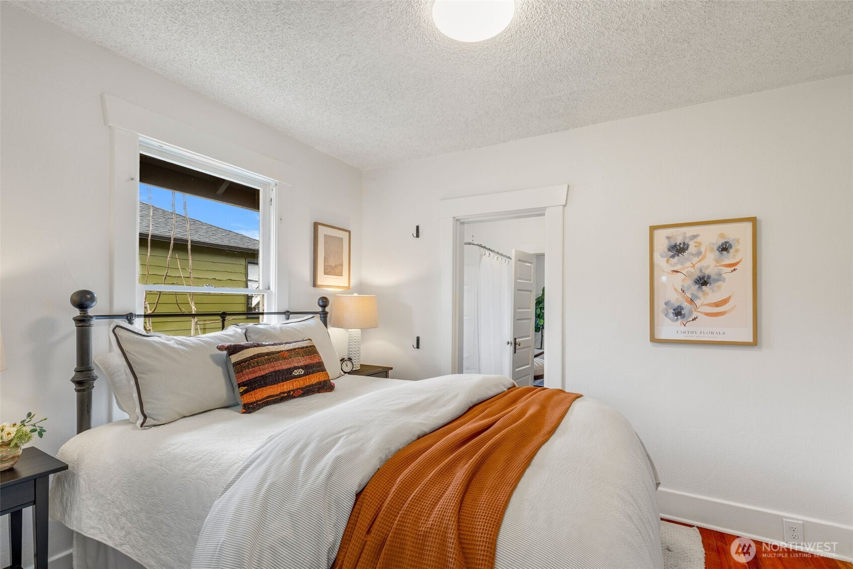 5812 46th Avenue South Seattle, WA 98118 - Photo 21 of 40 a bedroom with bed and a window