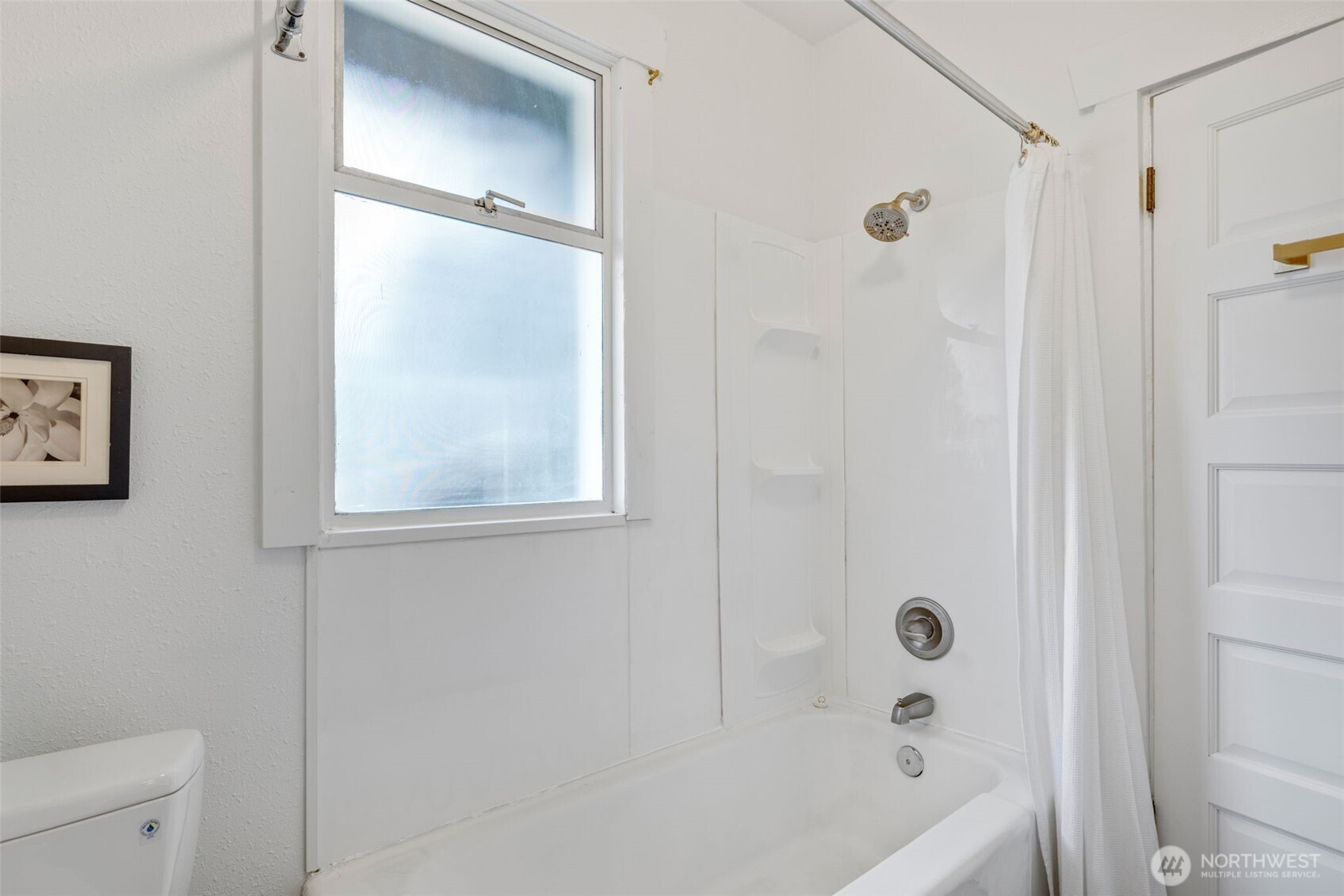 5812 46th Avenue South Seattle, WA 98118 - Photo 24 of 40 a bathroom with a bathtub and a shower