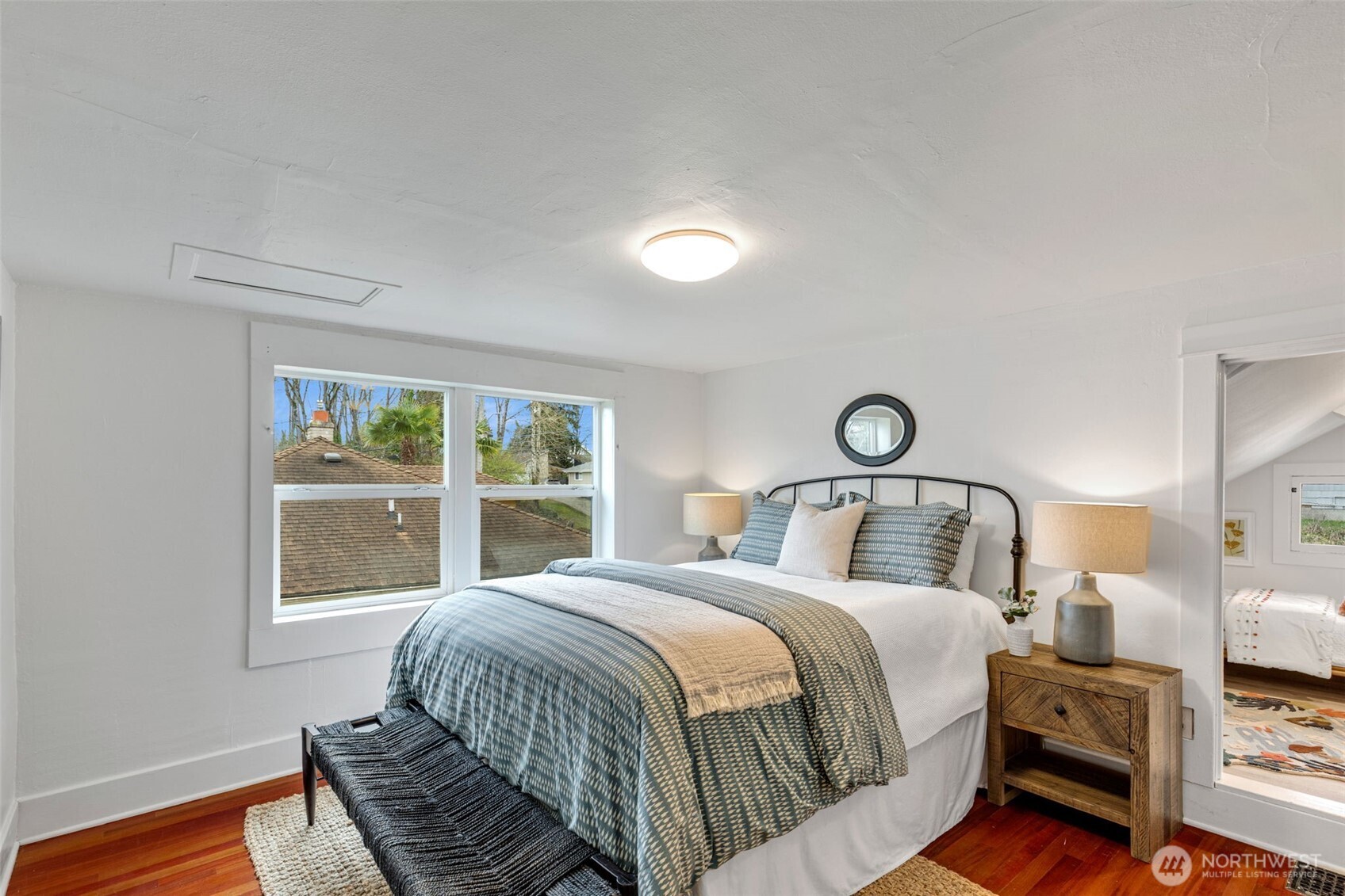 5812 46th Avenue South Seattle, WA 98118 - Photo 26 of 40 a bedroom with a bed and a window