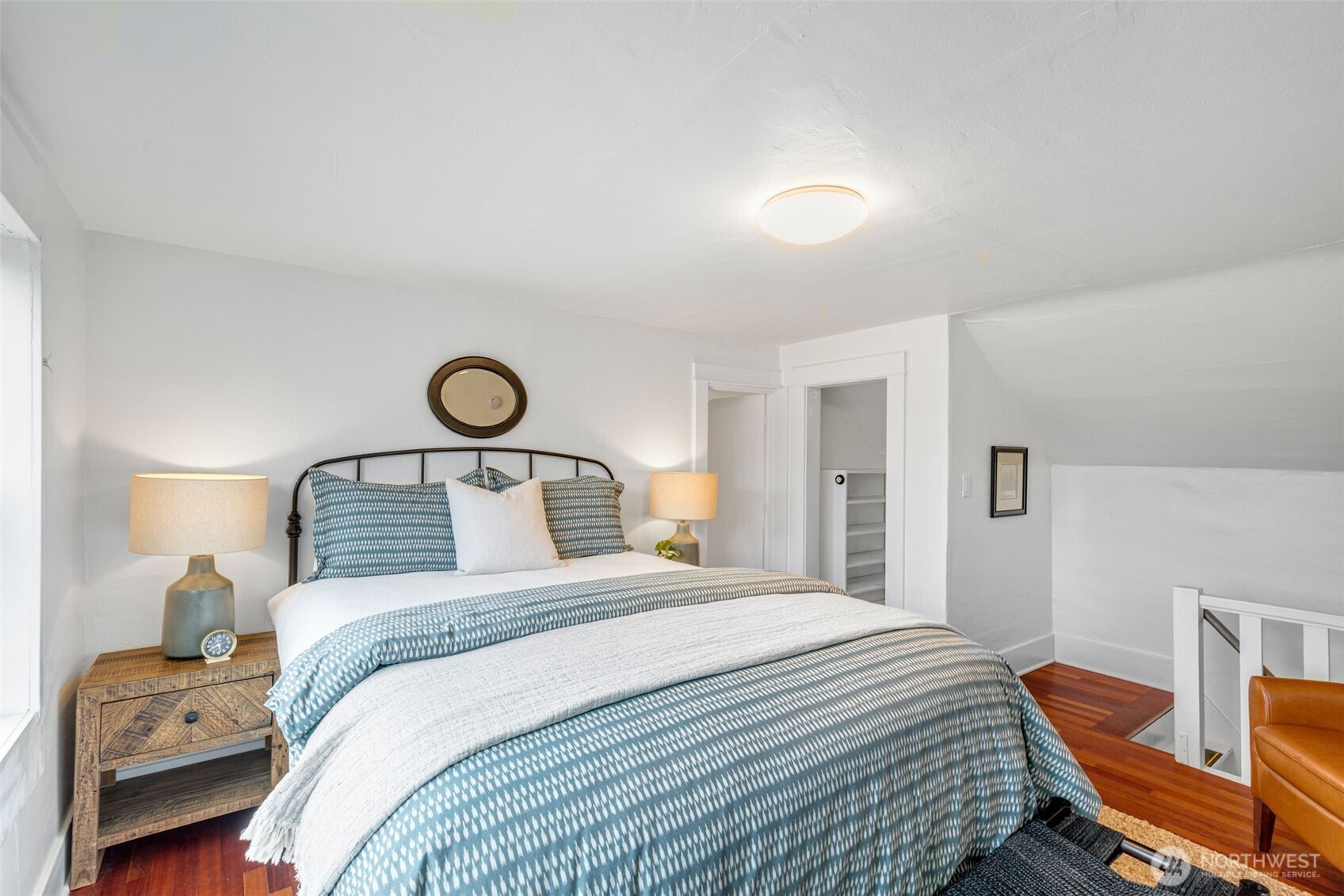 5812 46th Avenue South Seattle, WA 98118 - Photo 27 of 40 a bedroom with a bed and a lamp with the dresser