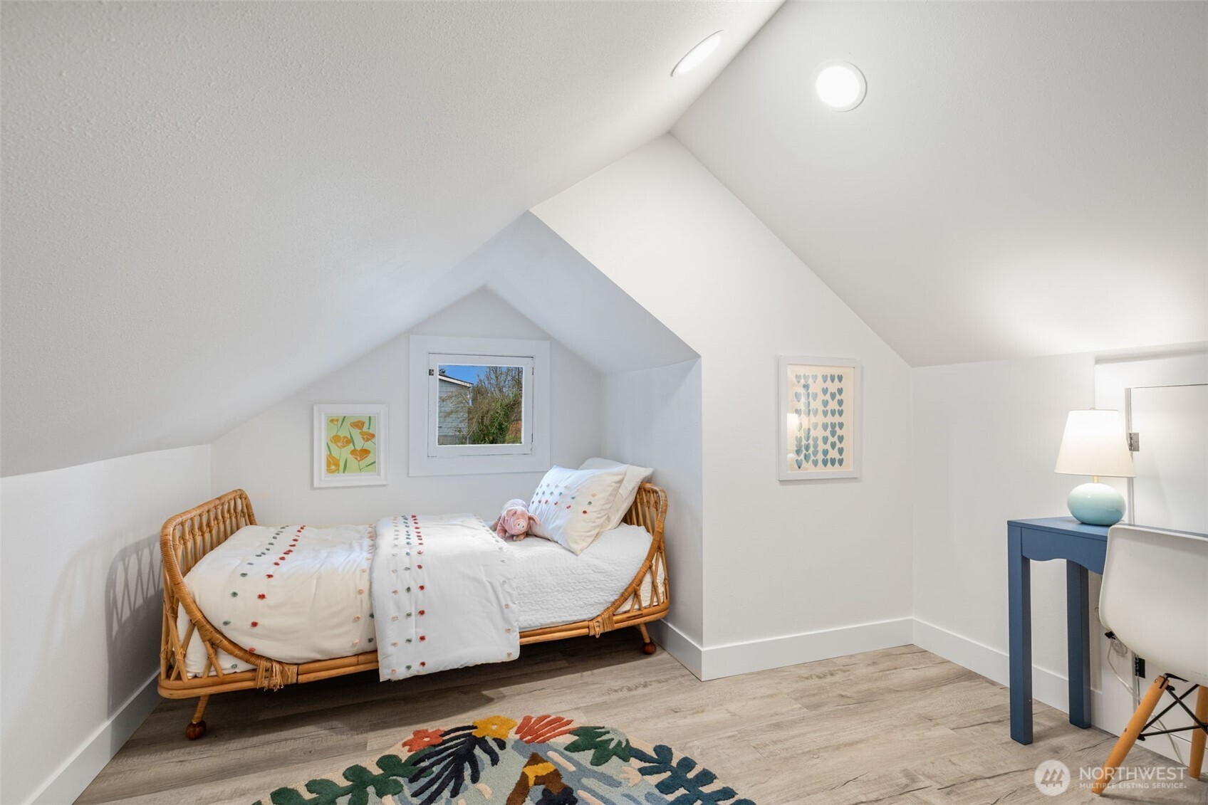 5812 46th Avenue South Seattle, WA 98118 - Photo 29 of 40 a bedroom with a bed and wooden floor