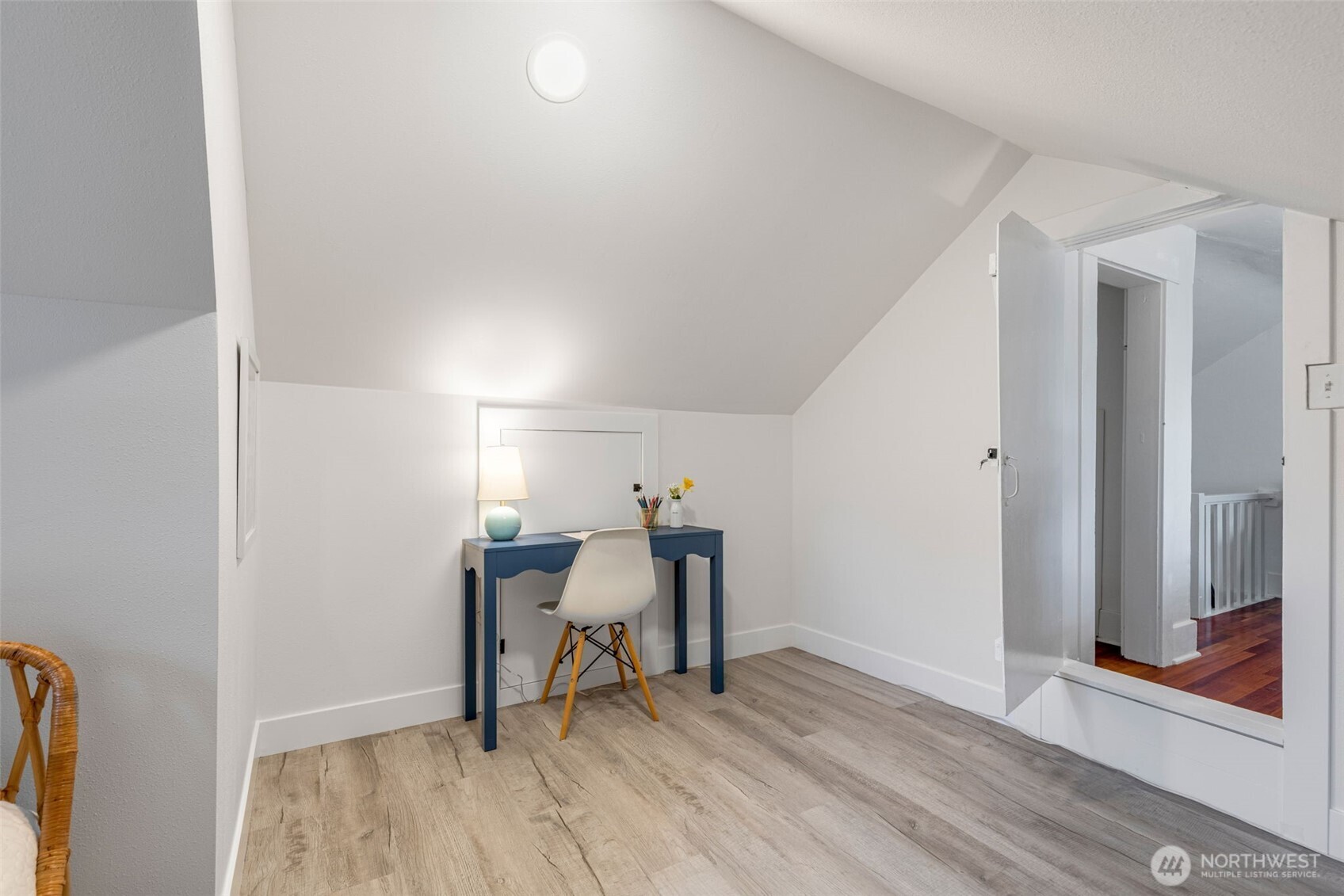 5812 46th Avenue South Seattle, WA 98118 - Photo 30 of 40 a view of a room with wooden floor table and chairs