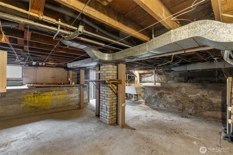 a wooden bench sitting in front of a building