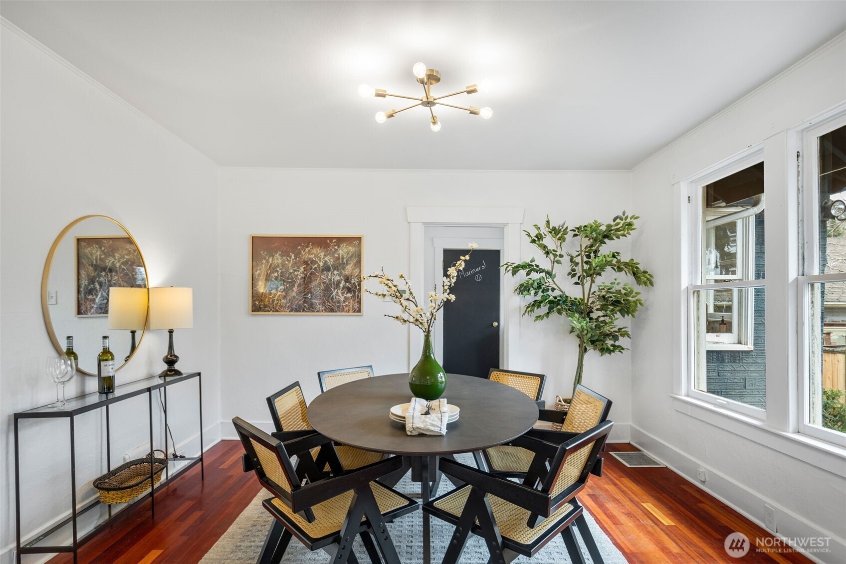 5812 46th Avenue South Seattle, WA 98118 - Photo 10 of 40 a view of a dining room with furniture and a potted plant