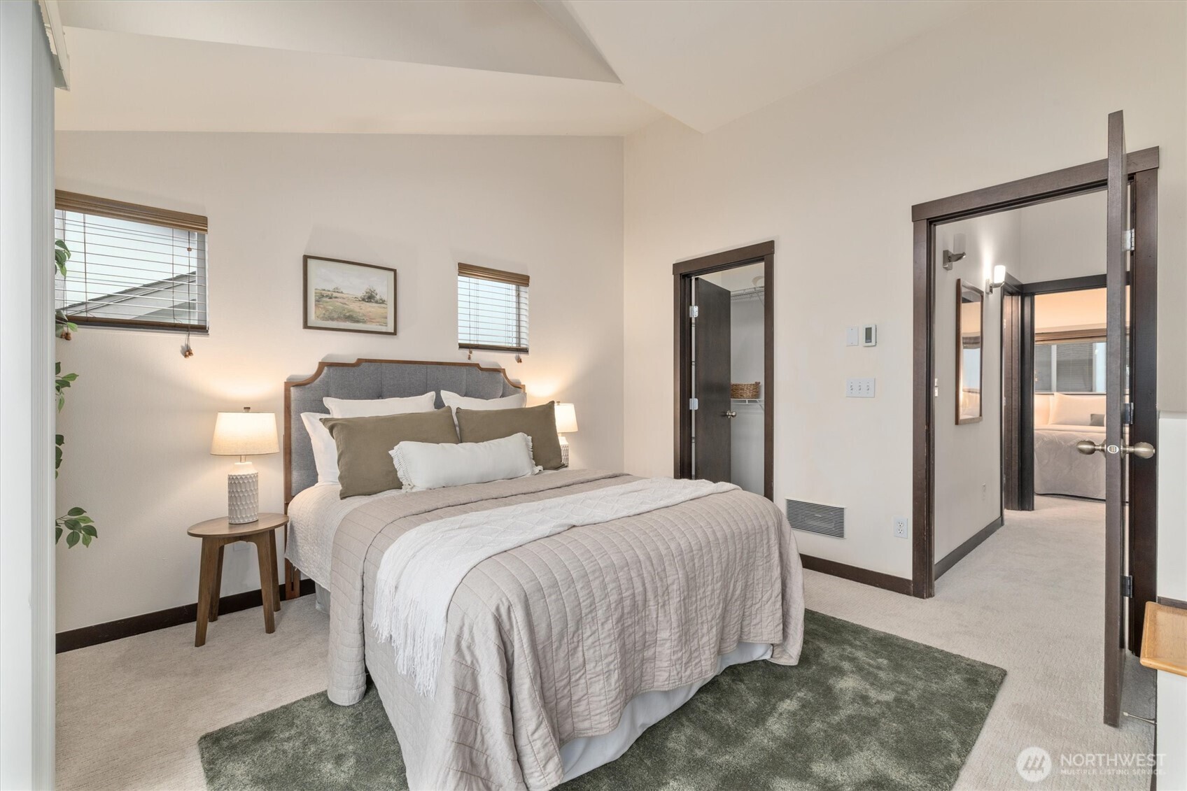 2516 Yale Avenue East, Unit C Seattle, WA 98102 - Photo 16 of 37 a bedroom with a bed and a mirror