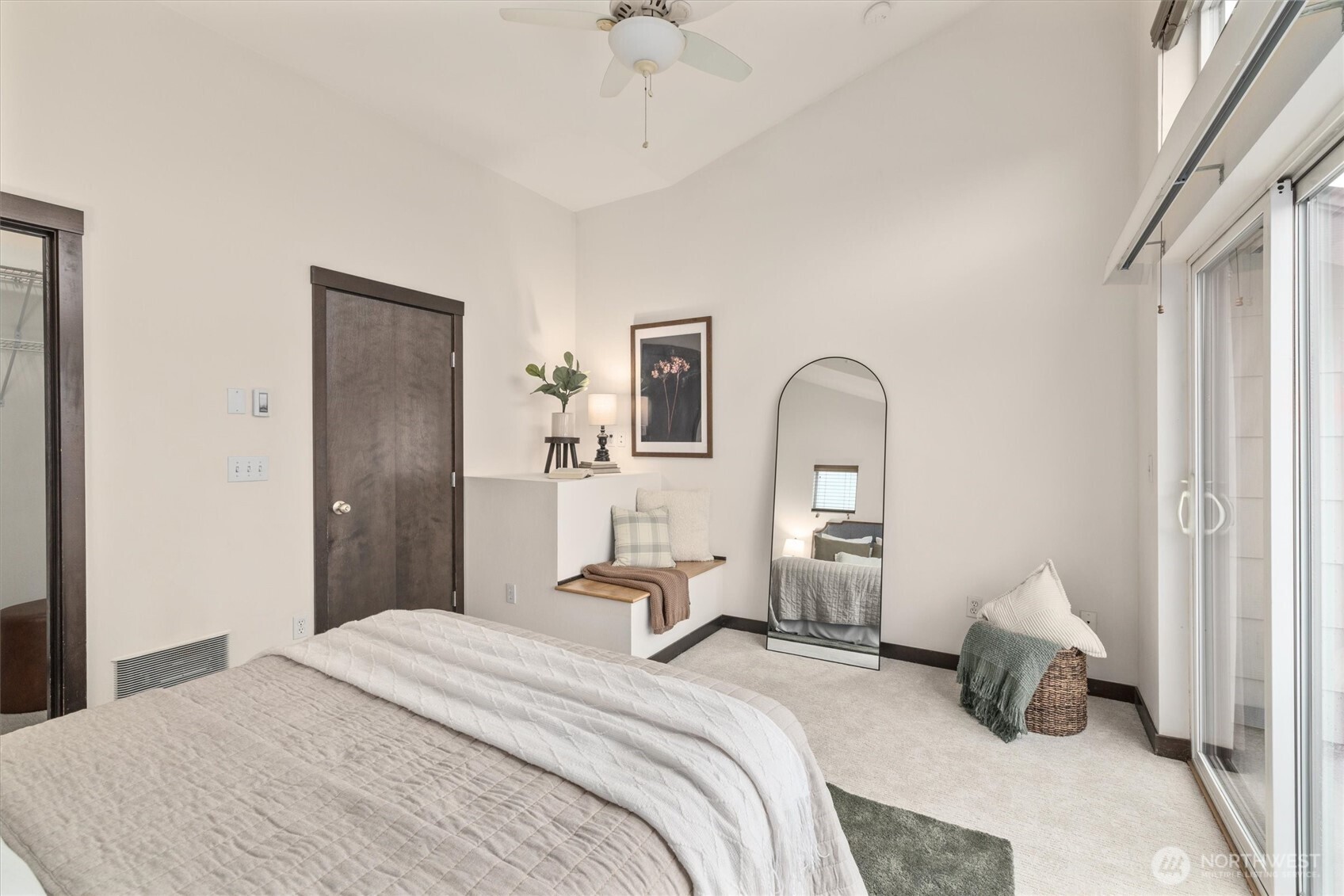 2516 Yale Avenue East, Unit C Seattle, WA 98102 - Photo 23 of 37 a bedroom with a bed and a chandelier