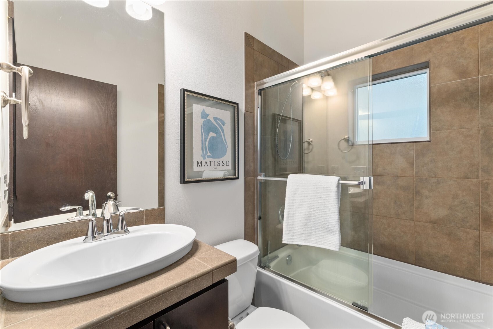 2516 Yale Avenue East, Unit C Seattle, WA 98102 - Photo 24 of 37 a bathroom with a sink and a mirror