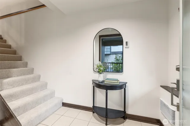 a view of entryway and hall with wooden floor