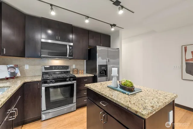 a dining room with furniture and wooden floor