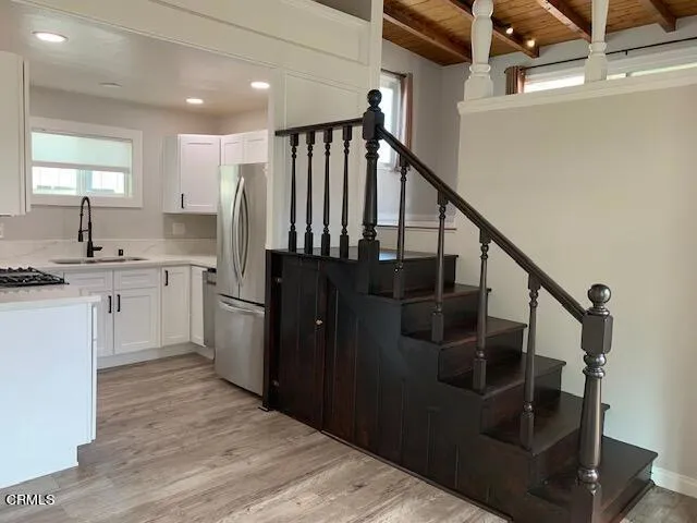 a kitchen with sink and cabinets